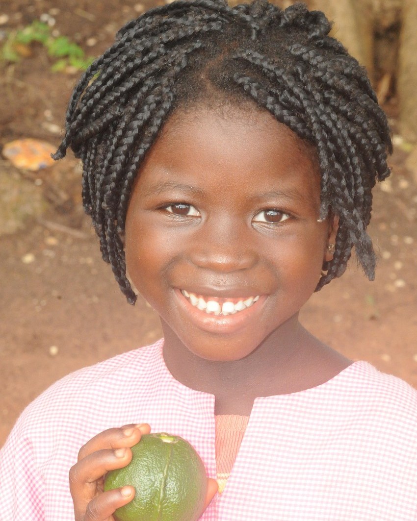 A smiling girl at a Chrysolite Foundation programme